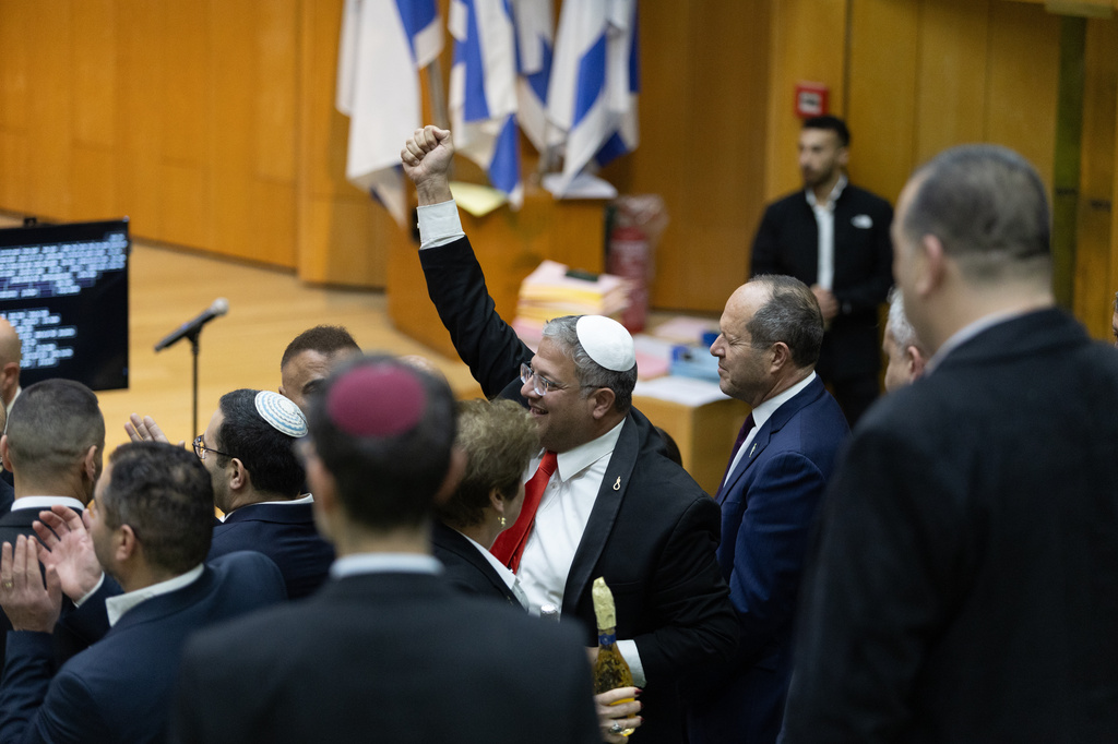 Israel's Minister of National Security, Itamar Ben-Gvir, center, and lawmakers celebrate after Israel's parliament passed a law approving the death penalty for Palestinians convicted of murdering Israelis, at the Knesset in Jerusalem Monday, March 30, 2026. (AP Photo/Itay Cohen)