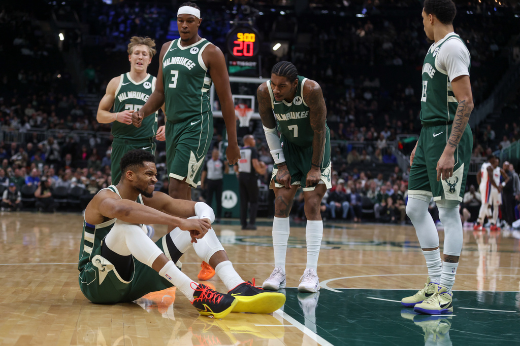 Milwaukee Bucks' Giannis Antetokounmpo reacts after suffering an injury during the first half an NBA basketball game against the Detroit Pistons, Wednesday, Dec. 3, 2025, in Milwaukee. (AP Photo/Kylie Bridenhagen)