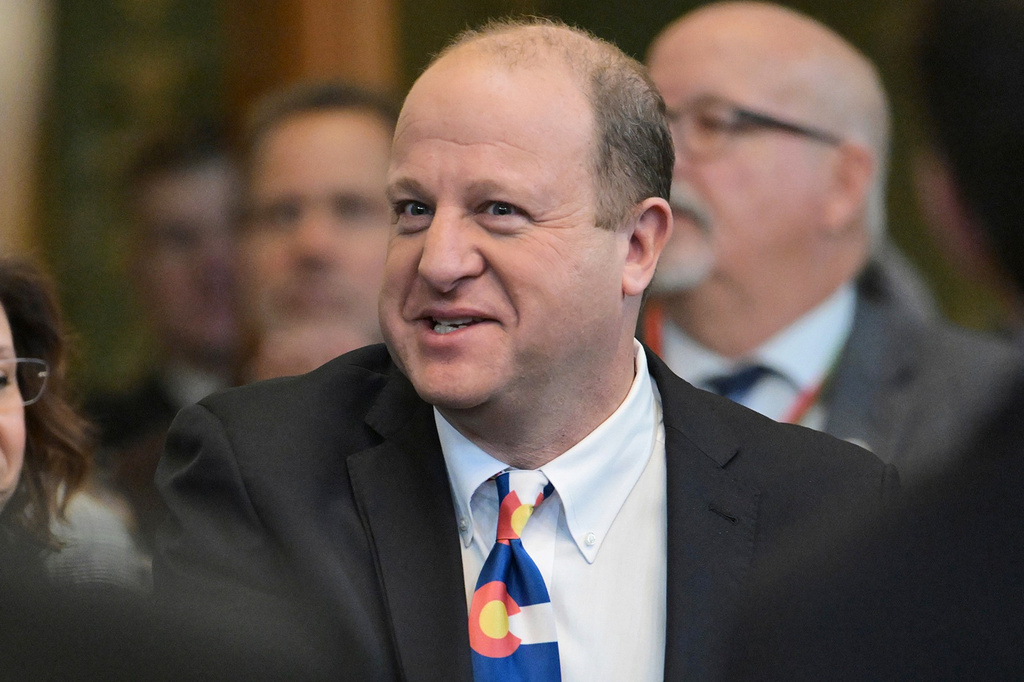 FILE - Colorado Gov. Jared Polis arrives in the House chamber of the Colorado State Capitol to deliver his state of the state address, Thursday, Jan. 9, 2025, in Denver. (Hyoung Chang/The Denver Post via AP, Pool, File)