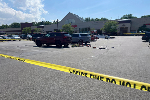 FILE - Crime scene tape is seen June 3, 2024, where a 3-year-old boy was fatally stabbed by a woman as he sat in a grocery cart in this Giant Eagle supermarket parking lot in North Olmsted, Ohio. (Hannah Drown/Cleveland.com via AP, File) FILE - Crime scene tape is seen June 3, 2024, where a 3-year-old boy was fatally stabbed by a woman as he sat in a grocery cart in this Giant Eagle supermarket parking lot in North Olmsted, Ohio. (Hannah Drown/Cleveland.com via AP, File)