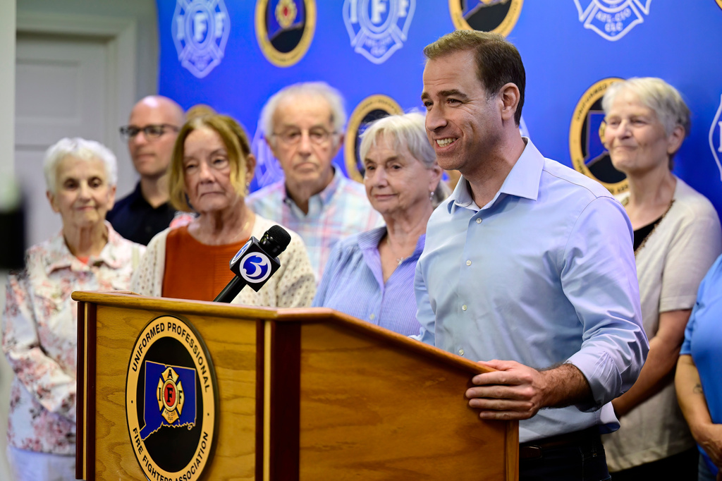 Former Mayor of Hartford and Democratic candidate for U.S. Representative Luke Bronin speaks at a news conference with firefighters and teachers, Thursday, July 23, 2026, in West Hartford, Conn. (AP Photo/Jessica Hill)