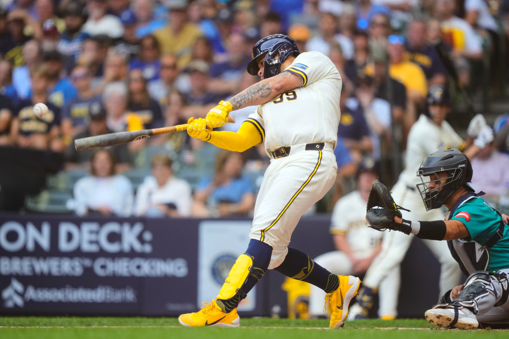 Milwaukee Brewers' Gary Sánchez (99) hits a two-run double, allowing Brice Turang and Jake Bauers to score, during the first inning of a baseball game against the Seattle Mariners, Thursday, Aug. 20, 2026, in Milwaukee. (AP Photo/Kayla Wolf)