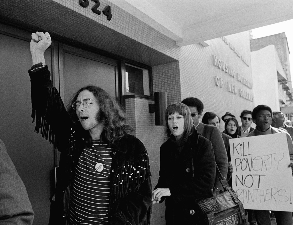 FILE - Actress Jane Fonda, center, joins the picket line with marchers in support of a group of black militant squatters whom police have tried to evict form city-owned apartments in New Orleans, Nov. 3, 1970. (AP Photo/Jack Thornell, File)