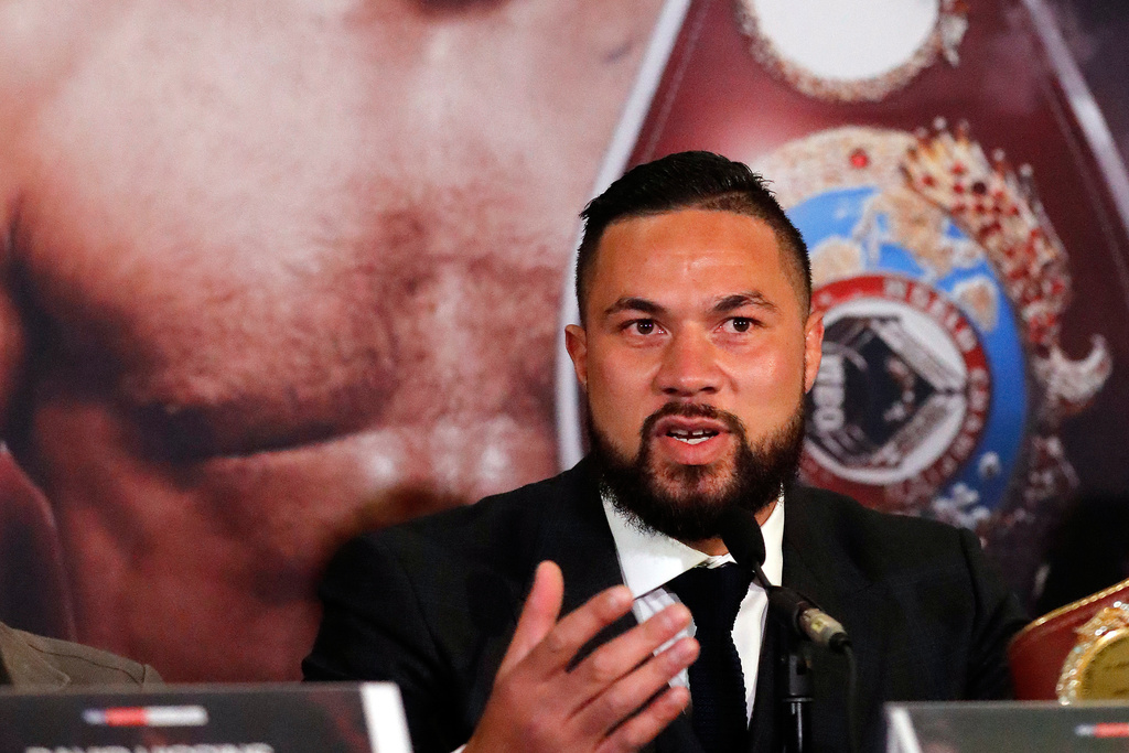 FILE - New Zealand's Joseph Parker speaks in front of his picture during a media conference with World Heavyweight boxer Anthony Joshua of Britain in London, Tuesday, Jan. 16, 2018. (AP Photo/Frank Augstein, File)