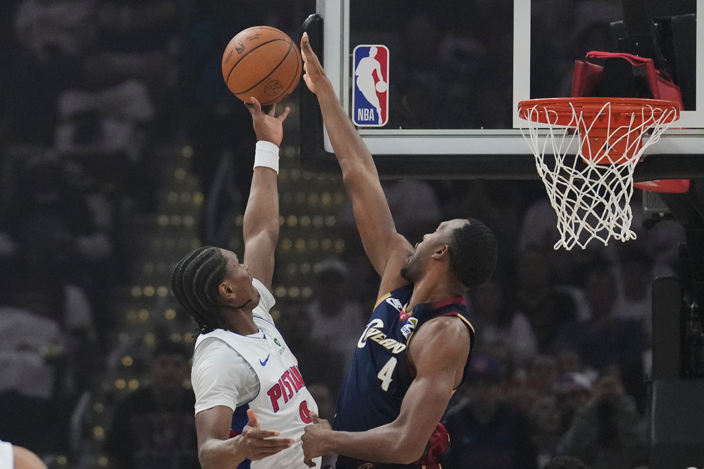Detroit Pistons guard Ausar Thompson (9) shoots as Cleveland Cavaliers center Evan Mobley (4) defends in the first half of Game 3 of a second-round NBA playoffs basketball series Saturday, May 9, 2026 in Cleveland. (AP Photo/Sue Ogrocki)