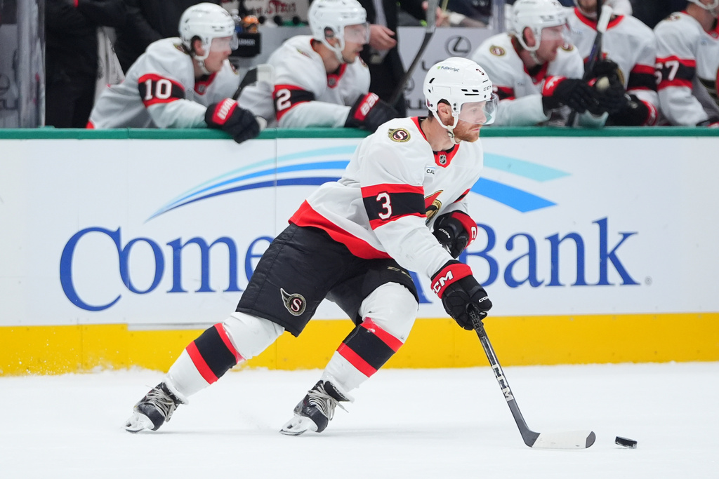 Ottawa Senators defenseman Nick Jensen skates with the puck during the first period of an NHL hockey game against the Dallas Stars, Sunday, Nov. 30, 2025, in Dallas. (AP Photo/LM Otero)