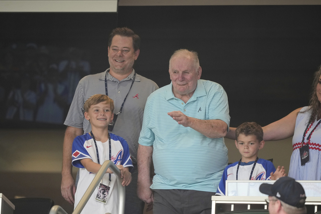 American former Atlanta Braves professional baseball player Bobby Cox waves to the crowd before a baseball game Friday, Aug. 22, 2025, in Atlanta. (AP Photo/Brynn Anderson)