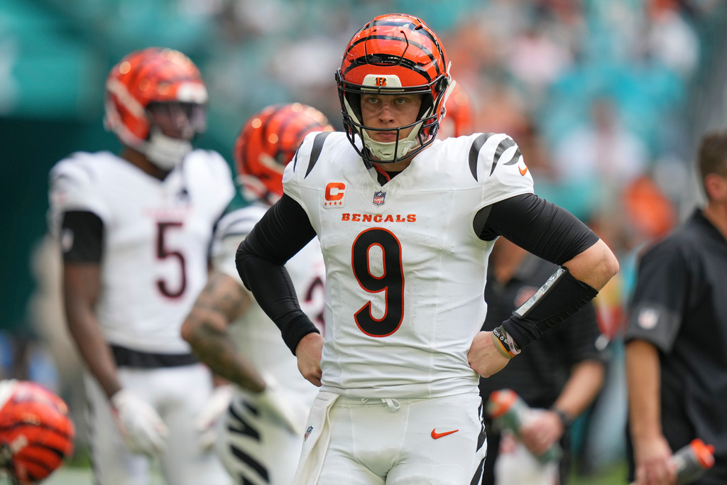 Cincinnati Bengals quarterback Joe Burrow (9) looks on during a timeout during the first half of an NFL game against the Miami Dolphins, Sunday, Dec. 21, 2025, in Miami Gardens, Fla. (AP Photo/Lynne Sladky)