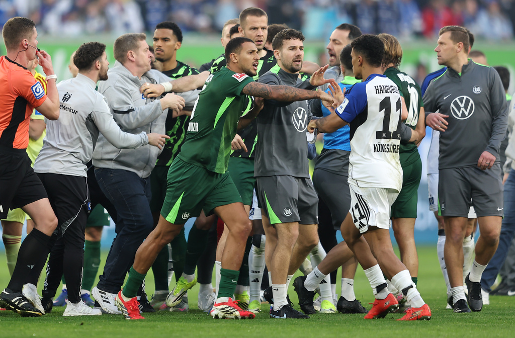 An altercation between Hamburger and Wolfsburg players following their German Bundesliga soccer match in Wolfsburg, Germany, Saturday, March 7, 2026. (Andreas Gora/dpa via AP)