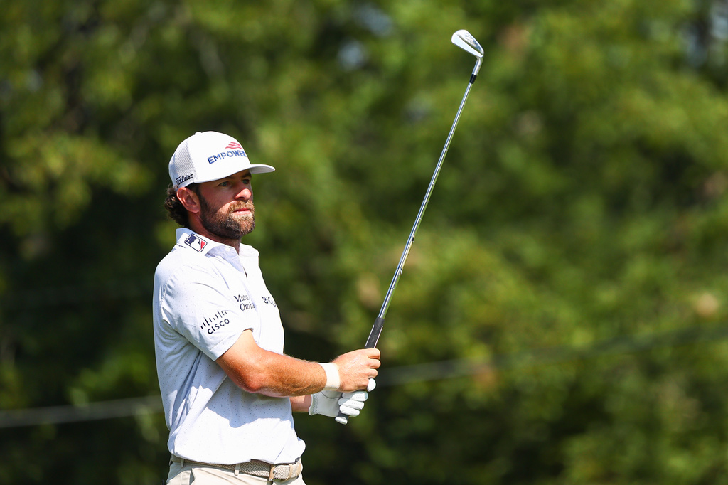 Cameron Young watches his shot from the fairway on the first hole during the second round of the Tour Championship golf tournament in Atlanta, Friday, Aug. 28, 2026. (AP Photo/Colin Hubbard)
