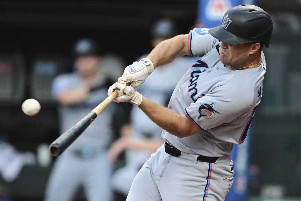 Miami Marlins' Jakob Marsee hits a three run home run off Cleveland Guardians starting pitcher Gavin Williams during the first inning of a baseball game, Wednesday, Aug. 13, 2025, in Cleveland. (AP Photo/David Dermer)