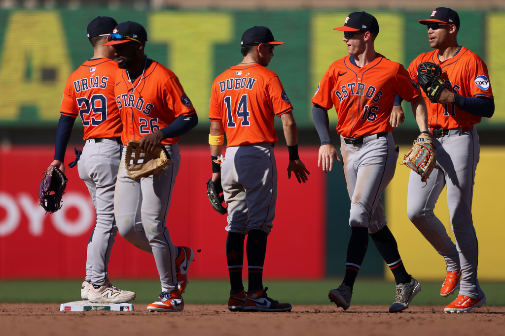 The Houston Astros celebrate their win over the Athletics in a baseball game Thursday, Sept. 25, 2025, in West Sacramento, Calif. (AP Photo/Scott Marshall)