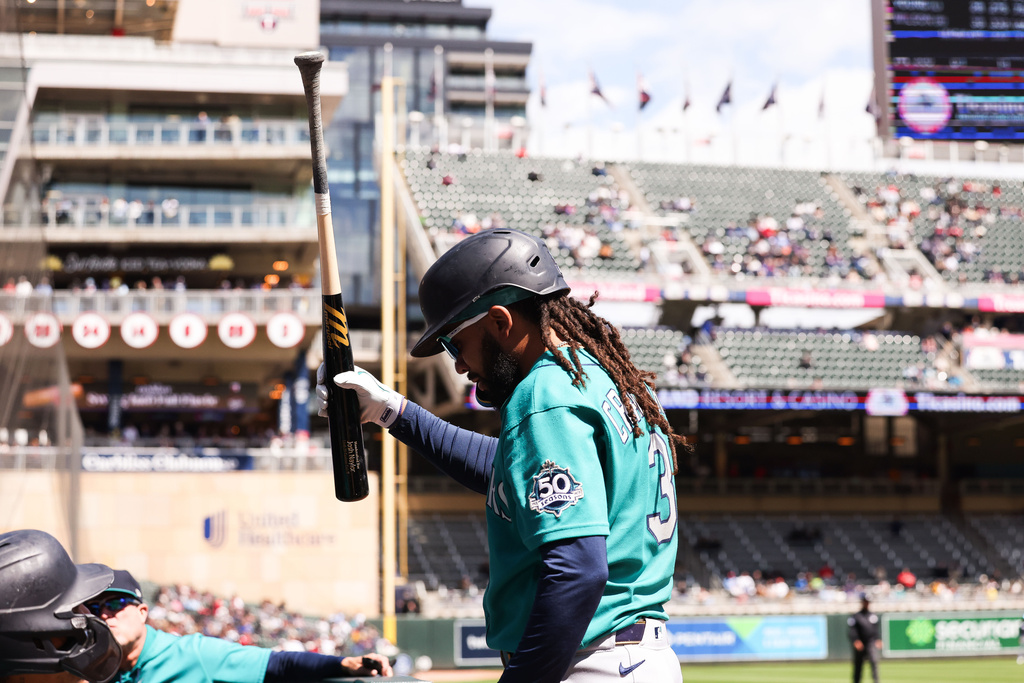 Seattle Mariners J.P. Crawford celebrates after hitting a home run during the third inning of a baseball game against the Minnesota Twins, Wednesday, April 29, 2026, in Minneapolis. (AP Photo/Stacy Bengs)