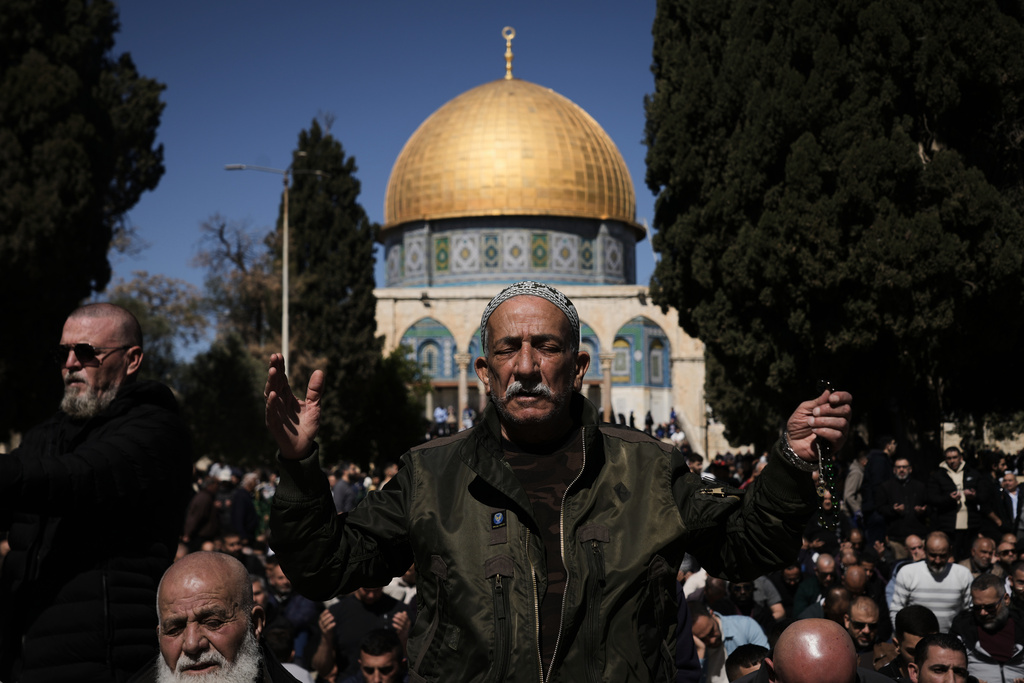 Muslim worshippers offer prayer on the first Friday of the holy month of Ramadan at the Al-Aqsa Mosque compound in Jerusalem's Old City, Friday, Feb. 20, 2026. (AP Photo/Mahmoud Illean)