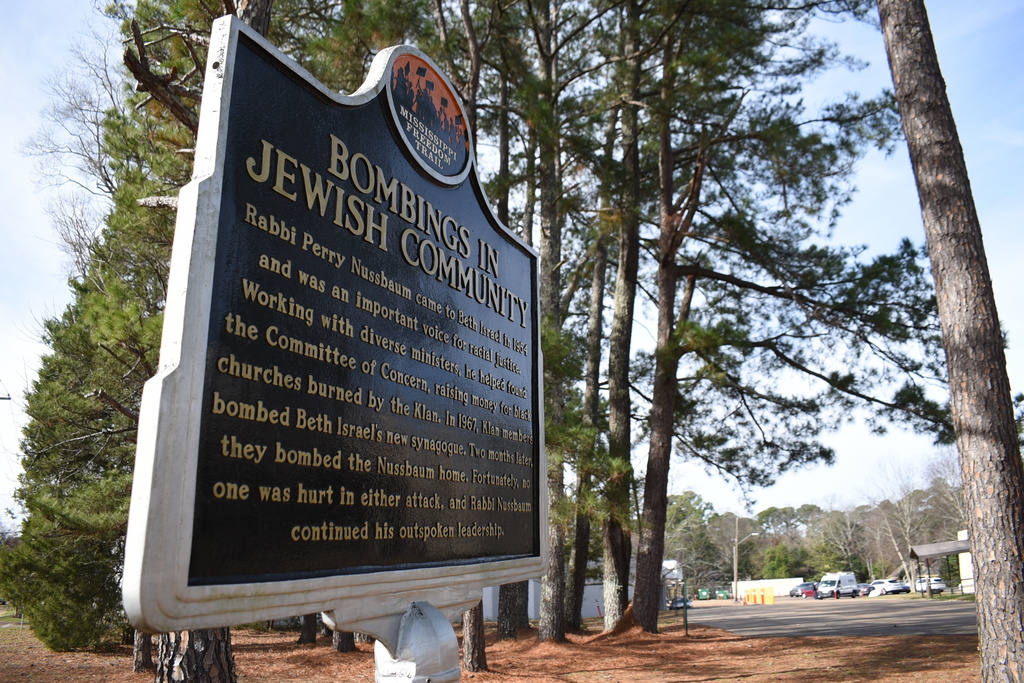 A sign describing when the synagogue was bombed by the Ku Klux Klan in 1967 stands outside the Beth Israel Congregation on Monday, Jan. 12, 2026, in Jackson, Miss. (AP Photo/Sophie Bates)