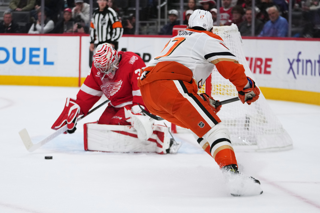 Detroit Red Wings goaltender John Gibson (36) stops a Anaheim Ducks left wing Alex Killorn (17) shot in the first period of an NHL hockey game Thursday, Nov. 13, 2025, in Detroit. (AP Photo/Paul Sancya)