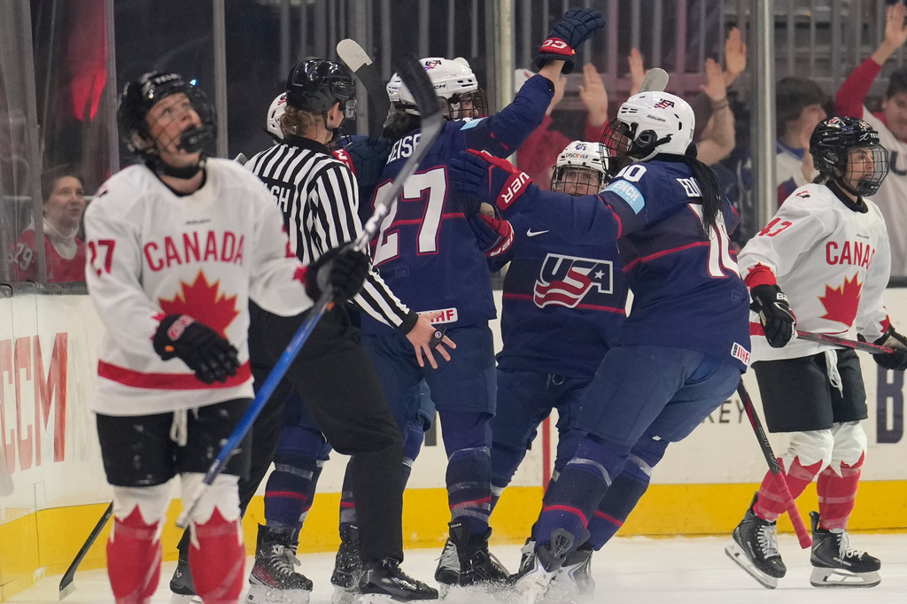 United States defense woman Laila Edwards (10), who assisted on the goal, celebrates with Taylor Heise after Heise scored in the first period of a Rivalry Series women's hockey game against Canada, Thursday, Nov. 6, 2025, in Cleveland. (AP Photo/Sue Ogrocki)