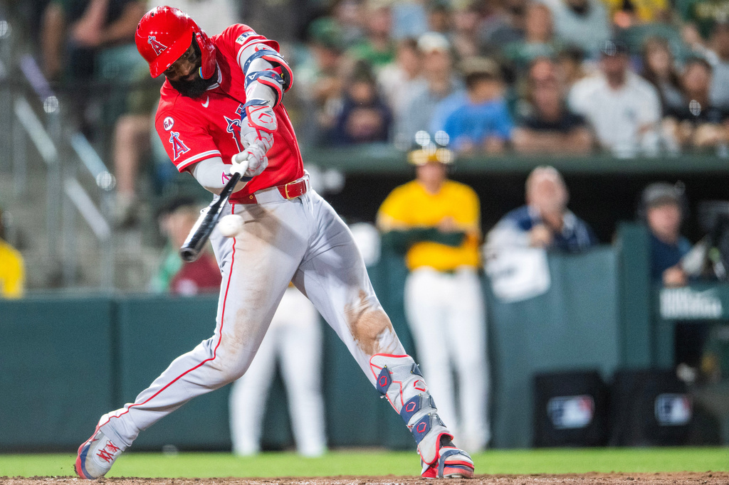 Los Angeles Angels' Jo Adell hits a double during the eighth inning of a baseball game against the Athletics in West Sacramento, Calif., Saturday, June 20, 2026. (AP Photo/Nic Coury)