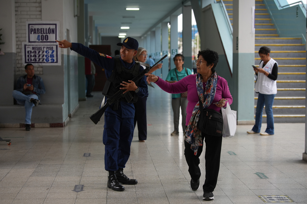 Voters arrive to a polling station during the presidential runoff election in Lima, Peru, Sunday, June 7, 2026. (AP Photo/Guadalupe Pardo)