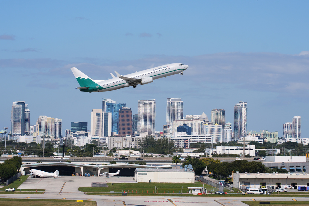 FILE - An American Airlines aircraft takes off from Fort Lauderdale-Hollywood International Airport, Thursday, Nov. 13, 2025, in Fort Lauderdale, Fla. (AP Photo/Lynne Sladky,File)