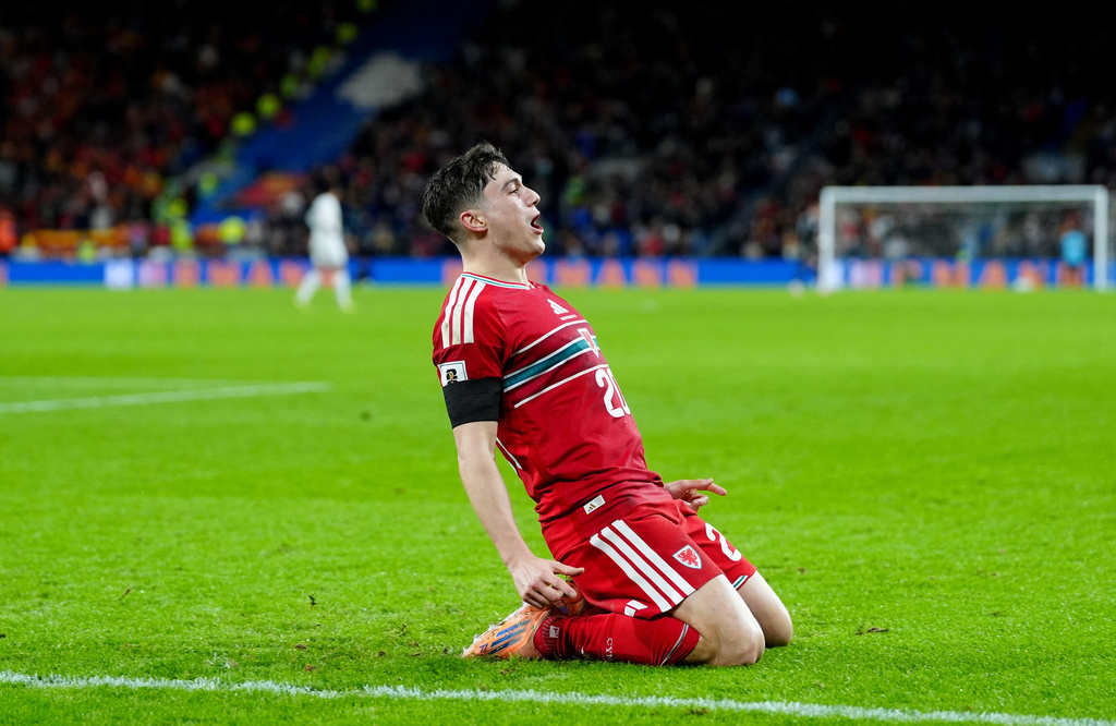 Wales' Dan James celebrates scoring their side's fourth goal of the game during their World Cup European Qualifying soccer match against North Macedonia in Cardiff, Wales, Tuesday, Nov. 18, 2025. (David Davies/PA via AP)