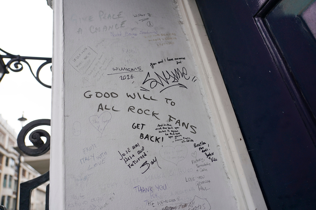 A view of a message written on the building in Savile Row where The Beatles held their last ever concert as a band, which is due to be turned into a fan museum in 2027, in London, Sunday, May 10, 2026. (AP Photo/Alberto Pezzali)