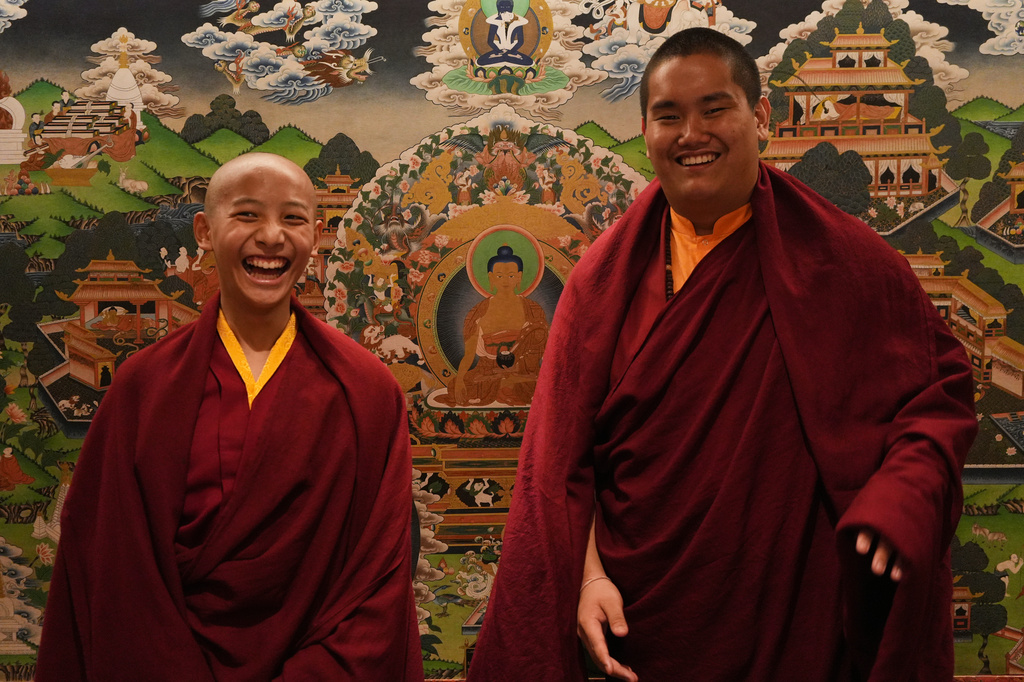 Buddhist lamas, Trulshik Yangsi Rinpoche, left, and Jalue Dorje, who is recognized as the eighth Terchen Taksham Rinpoche, laugh while posing for a portrait at the Yak and Yeti hotel in Kathmandu, Nepal, on Tuesday, April 7, 2026. (AP Photo/Luis Andres Henao)