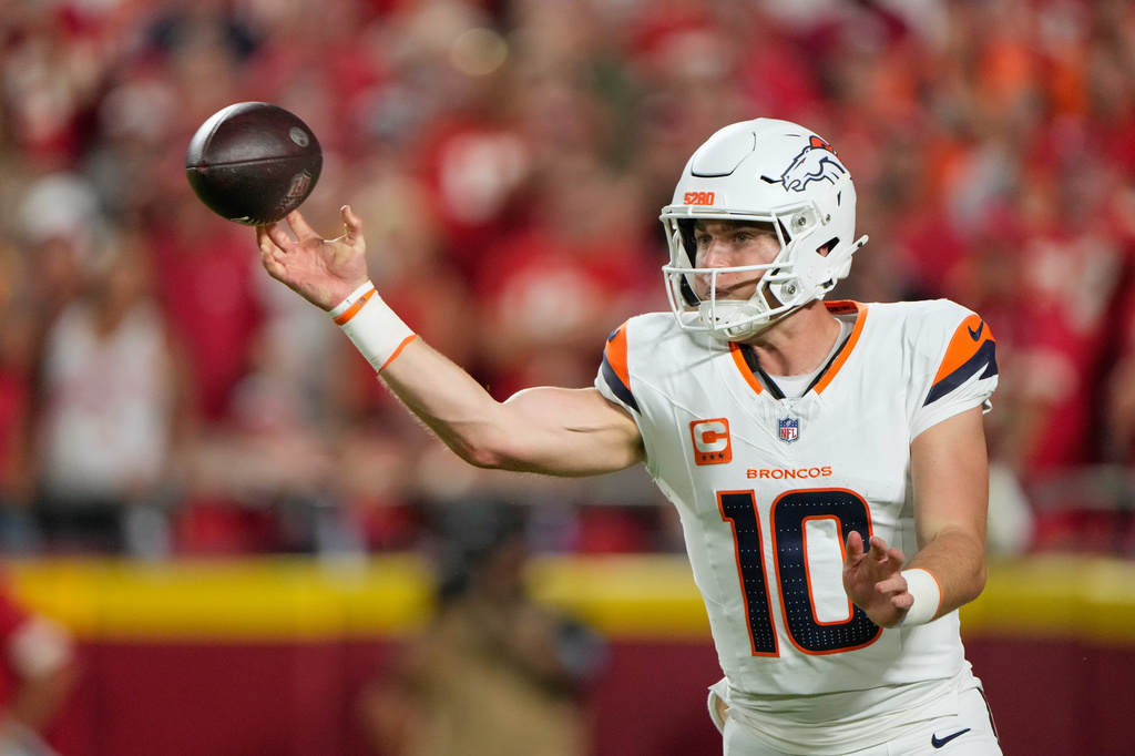 Denver Broncos quarterback Bo Nix throws a pass against the Kansas City Chiefs during the first half of an NFL football game Monday, Sept. 14, 2026, in Kansas City, Mo. (AP Photo/Charlie Riedel)