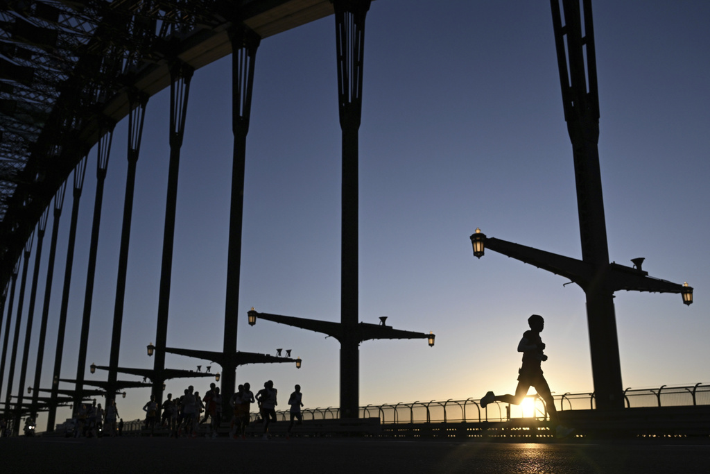 Runners cross the Sydney Harbour Bridge during the Sydney Marathon in Sydney, Sunday, Aug. 31, 2025. (Dean Lewins/AAP Image via AP)