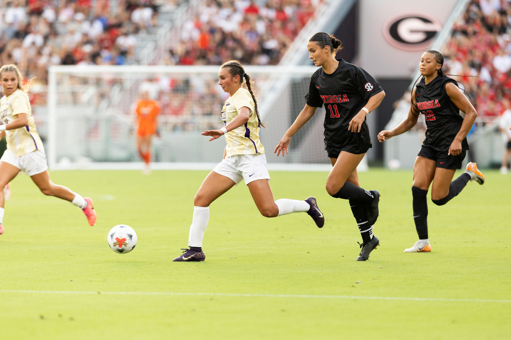 James Madison forward Olivia Del Toro (10) dribbles past Georgia midfielder Kiera Staude (11) and Georgia midfielder Kieryn Jeter (22) in the first half of a soccer match in Athens, Ga,, Thursday, Aug. 20, 2026.. (Photo/Evan Frilingos