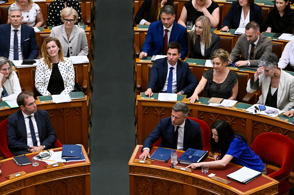Hungarian Prime Minister Peter Magyar, second right, and Foreign Minister Anita Orban, right, vote on the 17th amendment to the Fundamental Law at the plenary session of the parliament in in Bud(Robert Hegedus/MTI via AP)