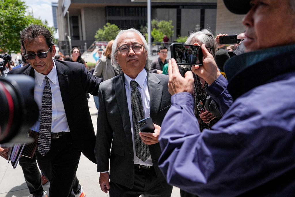 Kenneth Iwamasa, center, one of five people who pleaded guilty in the ketamine overdose death of actor Matthew Perry, leaves federal court after his sentencing in Los Angeles, Wednesday, May 27, 2026. (AP Photo/Jae C. Hong)