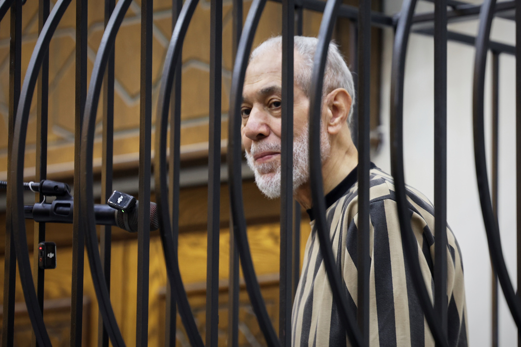 Syria's former grand mufti under ousted President Bashar Assad, Ahmad Badreddine Hassoun, stands as a court sentences him to life in prison at the Palace of Justice in Damascus, Syria, Monday, Aug. 24, 2026. (AP Photo/Ghaith Alsayed)