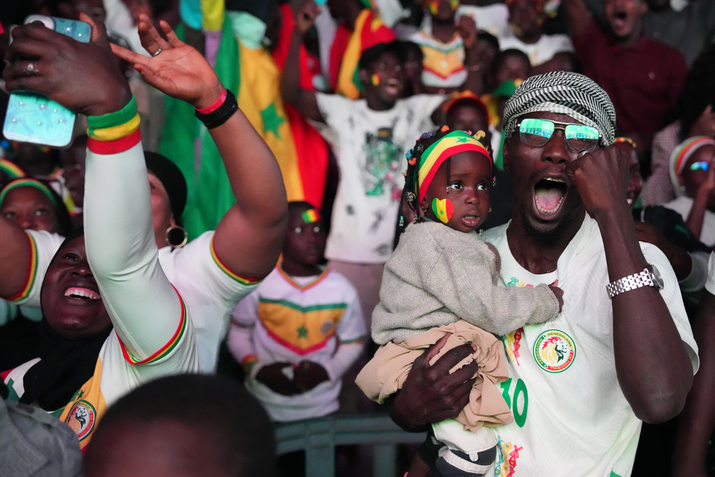 Fans celebrate Senegal's victory of the Africa Cup of Nations final soccer match between Senegal and Morocco in Dakar, Senegal, Sunday, Jan. 18, 2026. (AP Photo/Misper Apawu)