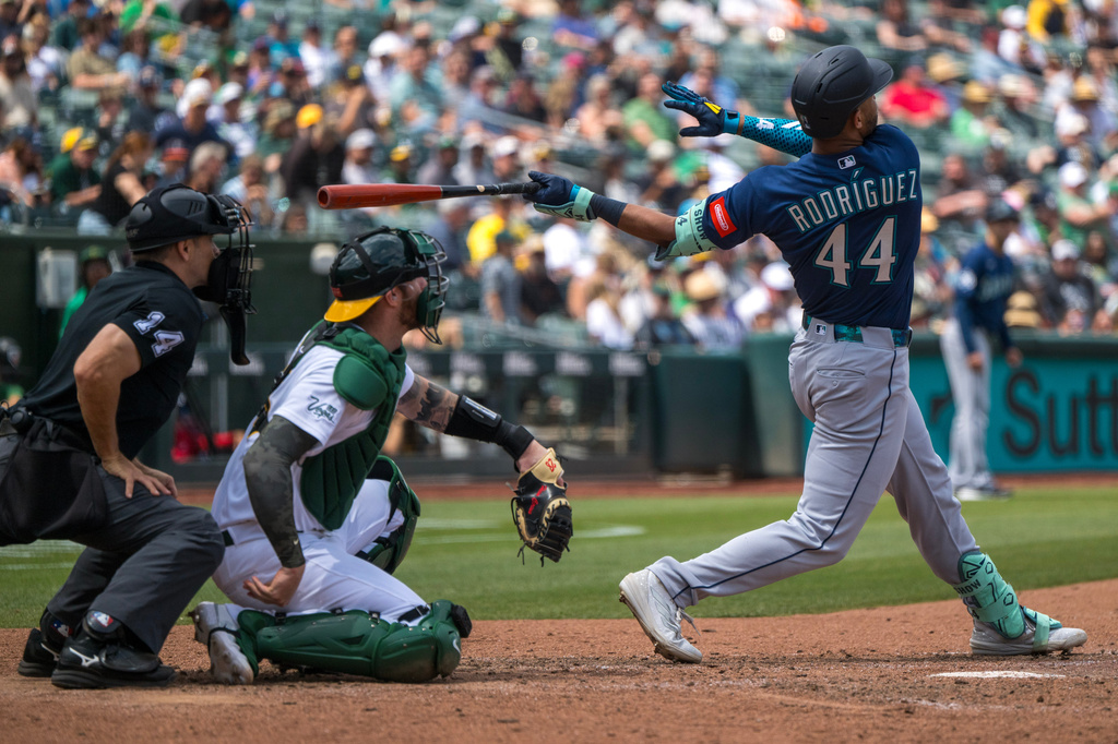 Seattle Mariners' Julio Rodríguez (44) hits a home run during the eighth inning of a baseball game against the Athletics in West Sacramento, Calif., Wednesday, May 27, 2026. (AP Photo/Nic Coury)