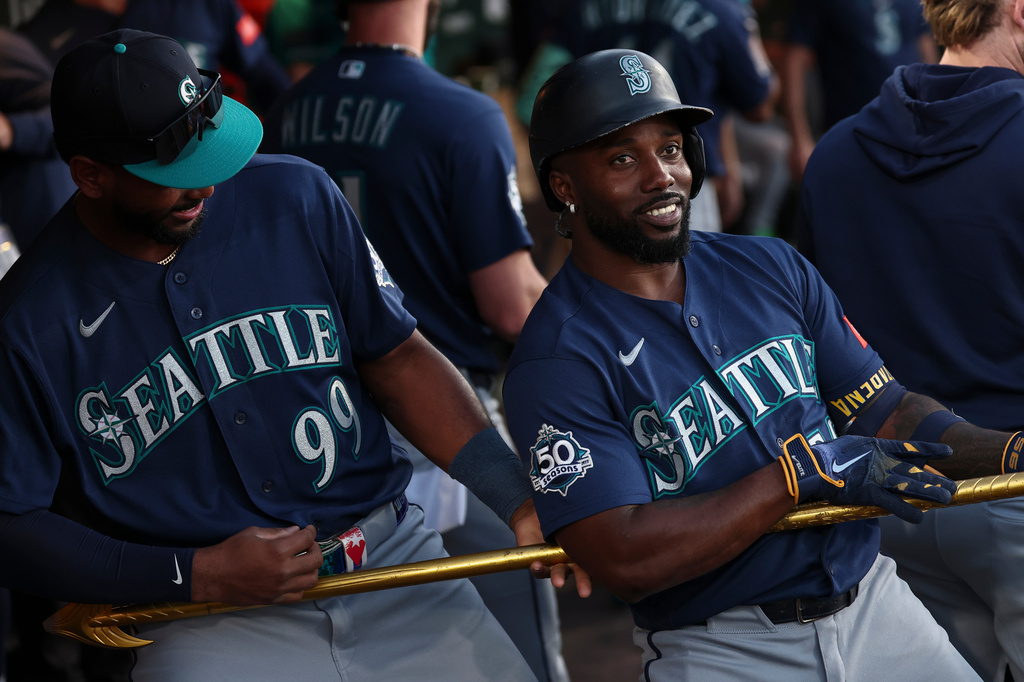 Seattle Mariners' Randy Arozarena, right, celebrates with Lazaro Montes (99) after hitting a three-run home run during the second inning of a baseball game against the Athletics, Saturday, Sept. 12, 2026, in West Sacramento, Calif. (AP Photo/Sara Nevis)