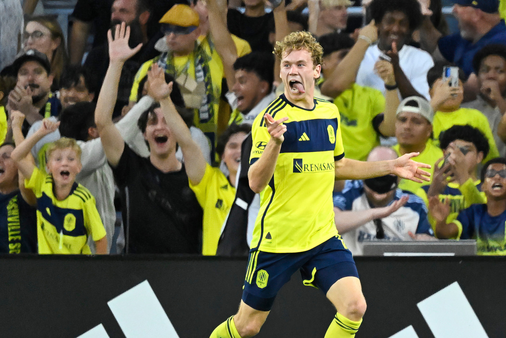 Nashville SC forward Jacob Shaffelburg (14) celebrates a goal against Inter Miami during the first half of a MLS soccer match Saturday, Oct. 28, 2025, in Nashville, Tenn. (AP Photo/John Amis)