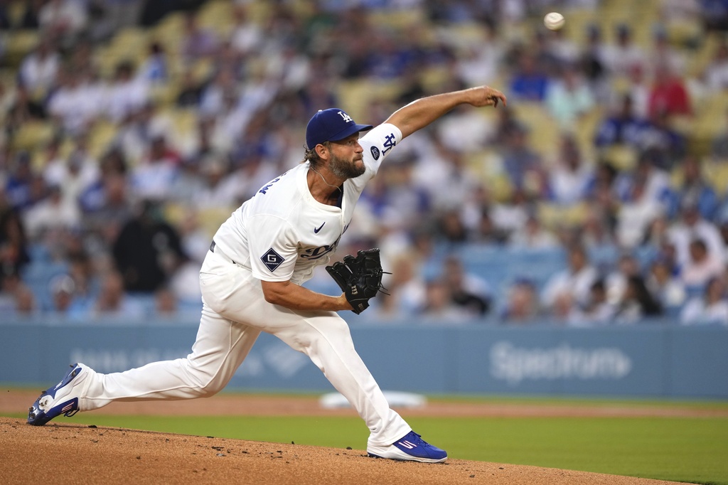 Los Angeles Dodgers starting pitcher Clayton Kershaw throws to the plate during the first inning of a baseball game against the Cincinnati Reds, Tuesday, Aug. 26, 2025, in Los Angeles. (AP Photo/Mark J. Terrill)