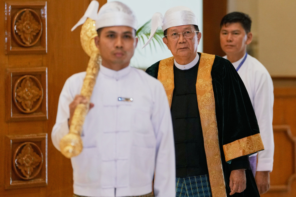 Parliament chairman Aung Lin Dwe, center, arrives for a session of Union Parliament in Naypyitaw, Myanmar, Friday, April 3, 2026. (AP Photo/Aung Shine Oo)