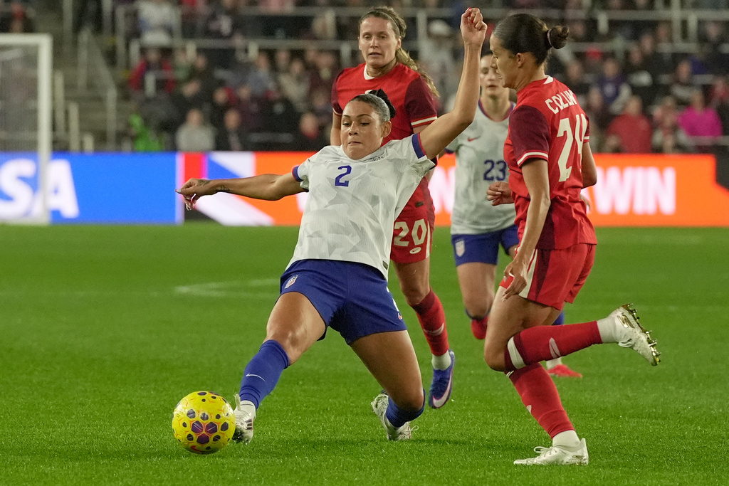 United States' Trinity Rodman (2) passes in front of Canada's Sydney Collins (24) in the first half of a SheBelieves Cup women's soccer match in Columbus, Ohio, Wednesday, March 4, 2026. (AP Photo/Sue Ogrocki)