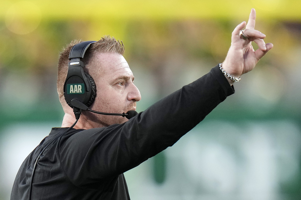 South Florida head coach Alex Golish calls a play against Boise State during the second half of an NCAA college football game Thursday, Aug. 28, 2025, in Tampa, Fla. (AP Photo/Chris O'Meara)