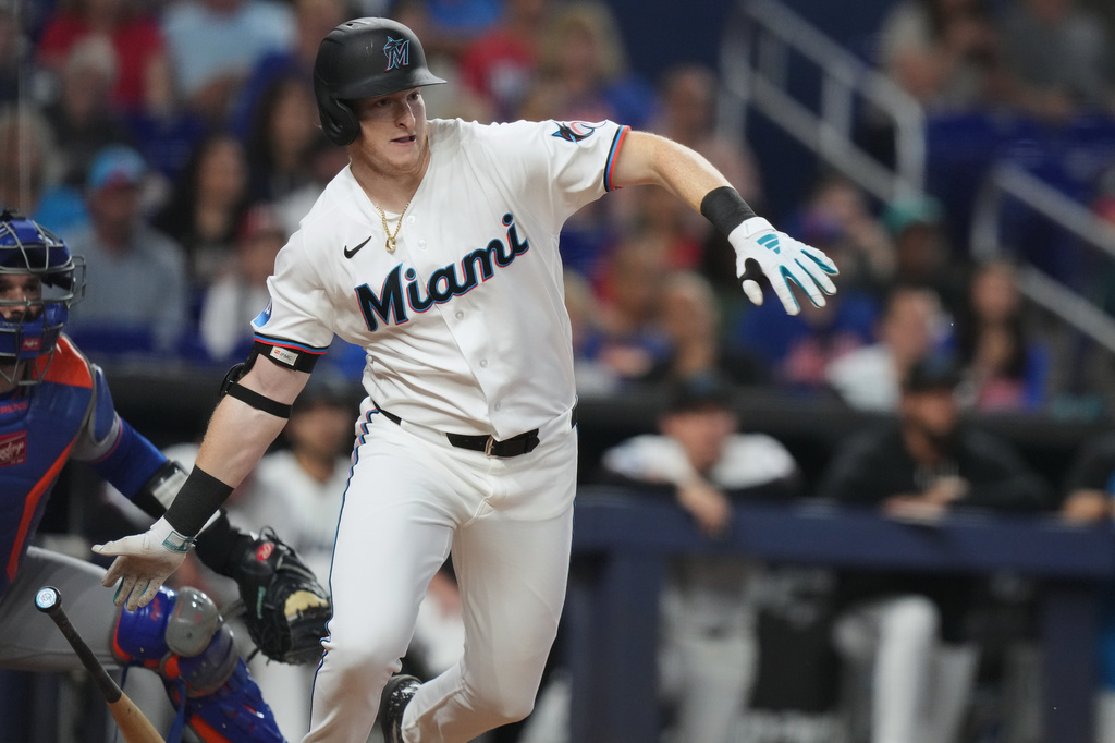 Miami Marlins' Owen Caissie runs after hitting a RBI double to score two runs during the second inning of a baseball game against the New York Mets, Saturday, May 23, 2026, in Miami. (AP Photo/Lynne Sladky)