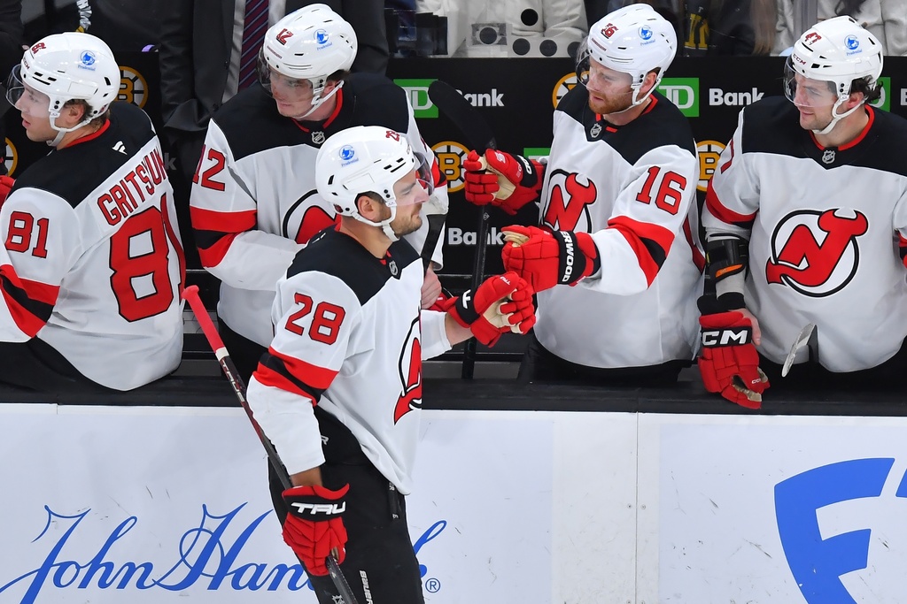 New Jersey Devils right wing Timo Meier (28) celebrates with teammates after scoring in the first period of an NHL hockey game against the Boston Bruins, Saturday, Dec. 6, 2025, in Boston. (AP Photo/Steven Senne)