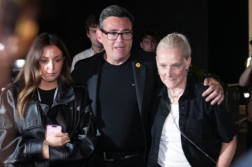 Britain's Labour party's Andy Burnham leaves with his wife Marie-France Van Heel and their daughter Rosie after winning the Makerfield by-election, paving the way for a leadership challenge against Prime Minister Sir Keir Starmer. in Wigan, England, Friday, June 19, 2026.(AP Photo/Jon Super)