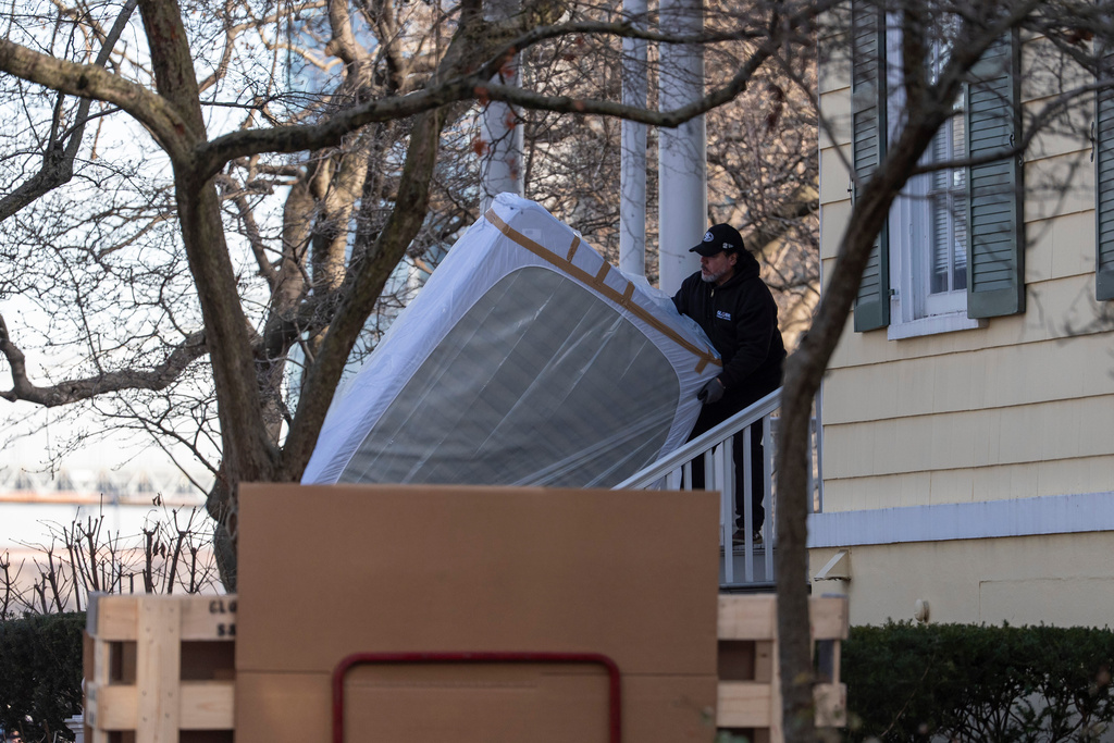 Movers carry a mattress to Gracie Mansion, Monday, Jan. 12, 2026, in New York. (AP Photo/Yuki Iwamura)