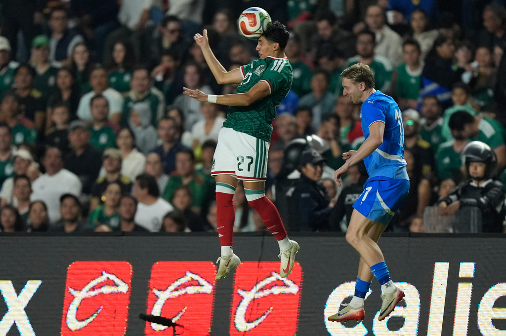 FILE - Mexico's Richard Ledezma, left, heads the ball in front of Iceland's Helgi Gudjonsson during an international friendly soccer match in Queretaro, Mexico, Wednesday, Feb. 25, 2026. (AP Photo/Fernando Llano, File)