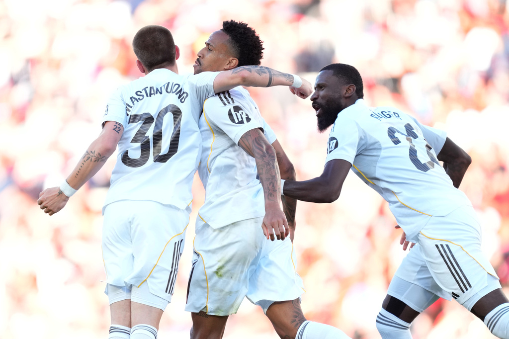 Real Madrid's Franco Mastantuono, left, Eder Militao, center, and Antonio Rudiger celebrate after a goal during a La Liga soccer match between Mallorca and Real Madrid in Palma de Mallorca, Spain, Saturday, April 4, 2026. (AP Photo/Jose Breton)