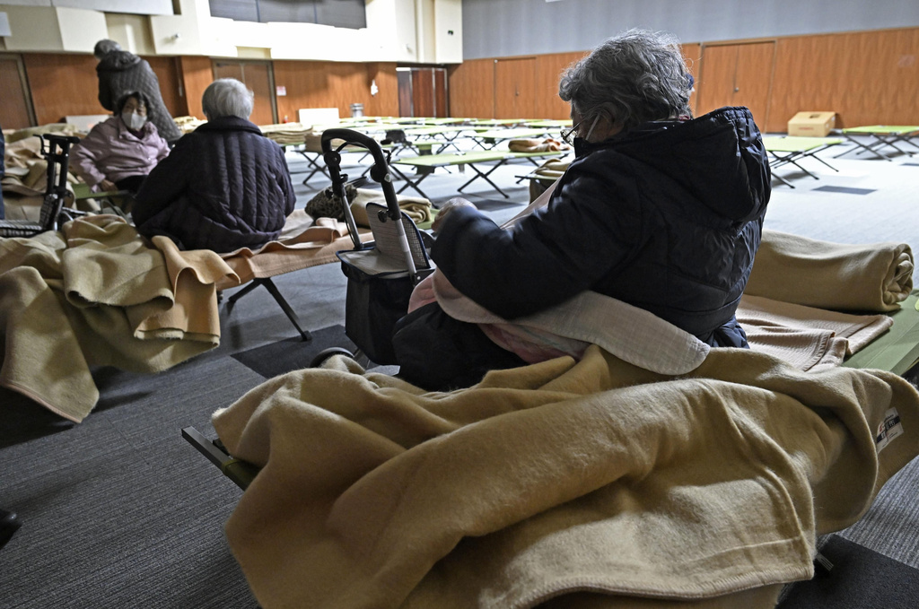 Evacuees get ready to return home as a tsunami advosory has been lifted in Hidaka town, northern Japan Tuesday, Dec. 9, 2025, following a powerful earthquake on late Monday. (Kyodo News via AP)