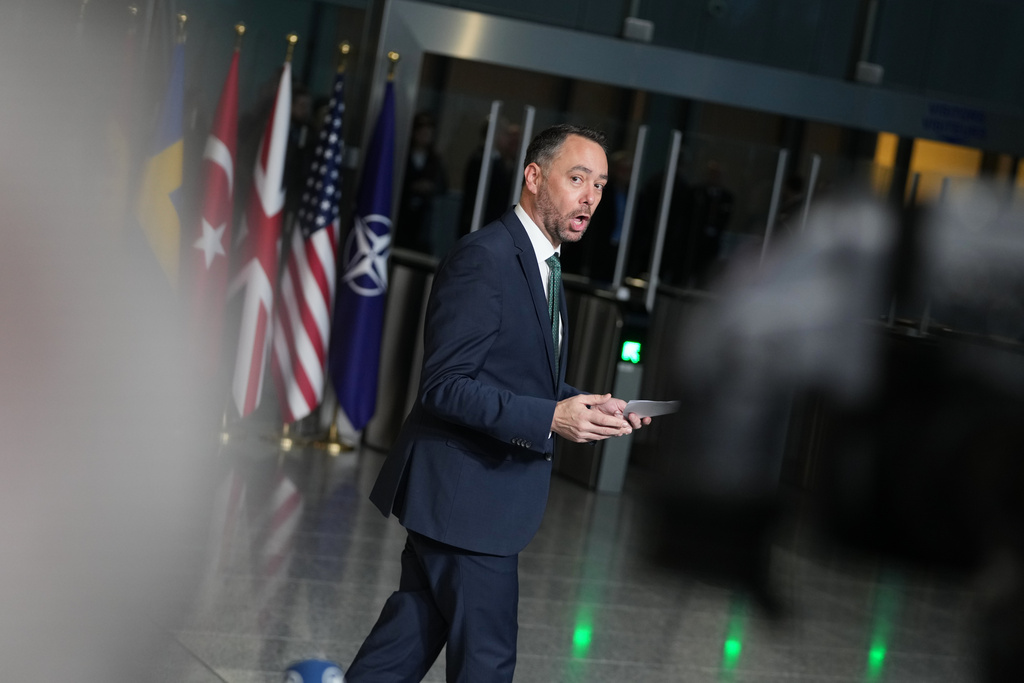 Belgium's Foreign Minister Maxime Prevot speaks with journalists as he arrives for a meeting of NATO foreign ministers at NATO headquarters in Brussels, Wednesday, Dec. 3, 2025. (AP Photo/Virginia Mayo)