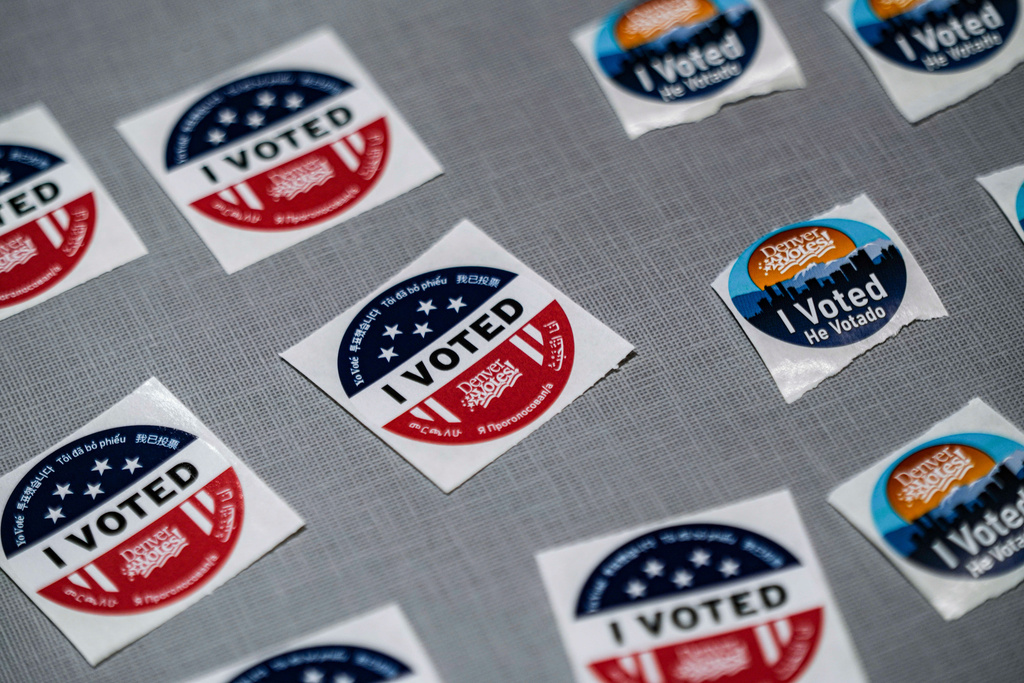 "I voted" stickers sit near a ballot box during the Democratic primaries at Denver Public Library Tuesday, June 30, 2026, in Denver. (AP Photo/Rebecca Slezak)